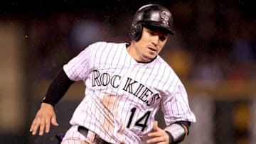 DENVER, CO - APRIL 21: Tony Wolters #14 of the Colorado Rockies rounds third base to score on a 2 run inside the park home run hit by Charlie Blackmon in the fourth inning against the San Francisco Giants at Coors Field on April 21, 2017 in Denver, Colorado. (Photo by Matthew Stockman/Getty Images)