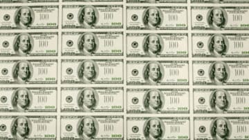 WASHINGTON - MARCH 26: Sheets of one hundred dollar bills wait to be cut into singles at the Bureau of Engraving and Printing on March 26, 2009 in Washington, DC. The roots of The Bureau of Engraving and Printing can be traced back to 1862, when a single room was used in the basement of the main Treasury building before moving to its current location on 14th Street in 1864. The Washington printing facility has been responsible for printing all of the paper Federal Reserve notes up until 1991 when it shared the printing responsibilities with a new western facility that opened in Fort Worth, Texas. (Photo by Mark Wilson/Getty Images)