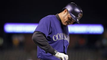 DENVER, CO - MAY 23: Nolan Arenado #28 of the Colorado Rockies grimaces after being hit in the hand with a pitch by starting pitcher Yusmeiro Petit #52 of the San Francisco Giants in the first inning during the second game of a double header at Coors Field on May 23, 2015 in Denver, Colorado. (Photo by Doug Pensinger/Getty Images)