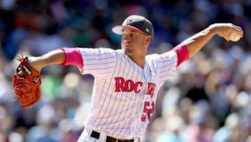 DENVER, CO - MAY 14: Pitcher Chris Rusin #52 of the Colorado Rockies throws in the sixth inning against the Los Angeles Dodgers at Coors Field on May 14, 2017 in Denver, Colorado. Members of both teams were wearing pink in commemoration of Mother's Day weekend. (Photo by Matthew Stockman/Getty Images)