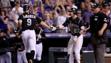 DENVER, CO - JULY 08: D.J. LeMahieu #9 of the Colorado Rockies is congratulated by Trevor Story #27 after scoring on a Gerardo Parra RBI double in the sixth inning against the Chicago White Sox at Coors Field on July 8, 2017 in Denver, Colorado. (Photo by Matthew Stockman/Getty Images)