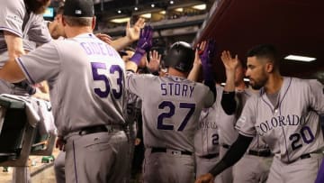 PHOENIX, AZ - OCTOBER 04: Trevor Story #27 of the Colorado Rockies reacts with teammates after hitting a solo home run during the top of the eighth inning of the National League Wild Card game against the Arizona Diamondbacks at Chase Field on October 4, 2017 in Phoenix, Arizona. (Photo by Christian Petersen/Getty Images)
