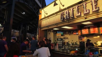 DENVER, CO - MAY 05: Fans visit the grille on the upper concourse of the stadium as sun sets while the Atlanta Braves defeat the Colorado Rockies 13-9 at Coors Field on May 5, 2012 in Denver, Colorado. (Photo by Doug Pensinger/Getty Images)