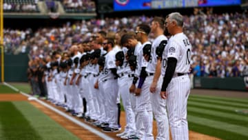 DENVER, CO - APRIL 7: Manager Bud Black of the Colorado Rockies stands on the first base line with rest of the team as the National Anthem plays before taking on the Los Angeles Dodgers on Opening Day at Coors Field on April 7, 2017 in Denver, Colorado. The Rockies defeated the Dodgers 2-1. (Photo by Justin Edmonds/Getty Images)