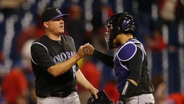 PHILADELPHIA, PA - MAY 24: Pitcher Jake McGee #51 of the Colorado Rockies is congratulated by catcher Tony Wolters #14 after getting the final out and defeating the Philadelphia Phillies 7-2 during a game at Citizens Bank Park on May 24, 2017 in Philadelphia, Pennsylvania. (Photo by Rich Schultz/Getty Images)