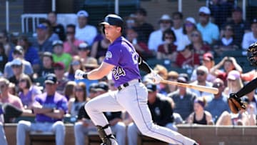 SCOTTSDALE, AZ - MARCH 12: Ryan McMahon #24 of the Colorado Rockies follows through on a swing during the second inning of a spring training game against the Arizona Diamondbacks at Salt River Fields at Talking Stick on March 12, 2018 in Scottsdale, Arizona. (Photo by Norm Hall/Getty Images)