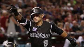 PHOENIX, AZ - MARCH 30: Gerardo Parra #8 of the Colorado Rockies celebrates after hitting a two-run home run against the Arizona Diamondbacks during the fourth inning of the MLB game at Chase Field on March 30, 2018 in Phoenix, Arizona. (Photo by Christian Petersen/Getty Images)