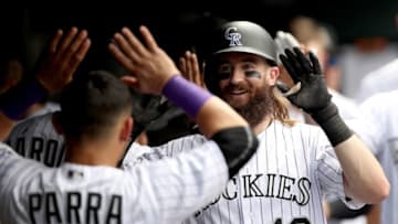 DENVER, CO - JULY 19: Charlie Blackmon #19 of the Colorado Rockies is congratulated in the dugout after hitting a home run in the fourth inning against the San Diego Padres at Coors Field on July 19, 2017 in Denver, Colorado. (Photo by Matthew Stockman/Getty Images)