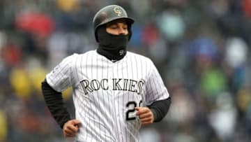 DENVER, CO - APRIL 06: Nolan Arenado #28 of the Colorado Rockies rounds third base to score on a Carlos Gonzalez RBI triple in the first inning against the Atlanta Braves at Coors Field on April 6, 2018 in Denver, Colorado. (Photo by Matthew Stockman/Getty Images)