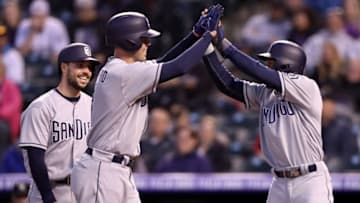 DENVER, CO - APRIL 09: Clayton Richard #3 of the San Diego Padres is congratulated at the plate by Austin Hedges #18 and Manuel Margot #7 after hitting a 3 RBI home run in the fourth inning against the Colorado Rockies at Coors Field on April 9, 2018 in Denver, Colorado. (Photo by Matthew Stockman/Getty Images)