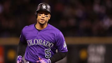 DENVER, CO - APRIL 09: Carlos Gonzalez #5 of the Colorado Rockies circles the bases after hitting a 2 RBI home run in the sixth inning against the San Diego Padres at Coors Field on April 9, 2018 in Denver, Colorado. (Photo by Matthew Stockman/Getty Images)