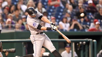 WASHINGTON, DC - APRIL 12: DJ LeMahieu #9 of the Colorado Rockies doubles Geraldo Parra #8 (not pictured) in the third inning during a baseball game against the Washington Nationals at Nationals Park on April 12, 2018 in Washington, DC. (Photo by Mitchell Layton/Getty Images)