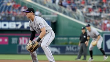 WASHINGTON, DC - APRIL 13: First baseman Ryan McMahon #24 of the Colorado Rockies follows the ball against the Washington Nationals at Nationals Park on April 13, 2018 in Washington, DC. (Photo by Rob Carr/Getty Images)