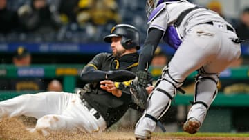 PITTSBURGH, PA - APRIL 17: Jordy Mercer #10 of the Pittsburgh Pirates is tagged out at home by Tony Wolters #14 of the Colorado Rockies in the eighth inning at PNC Park on April 17, 2018 in Pittsburgh, Pennsylvania. (Photo by Justin K. Aller/Getty Images)