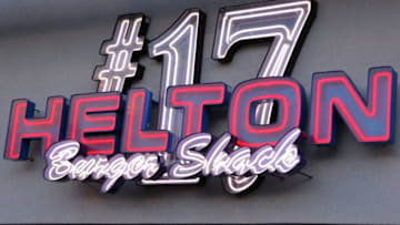DENVER, CO - JUNE 08: A neon sign adorns the Todd Helton #17 of the Colorado Rockies Burger Shack in left field at Coors Field on June 8, 2013 in Denver, Colorado. The Padres defeated the Rockies 4-2. (Photo by Doug Pensinger/Getty Images)
