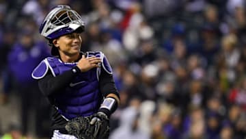 DENVER, CO - APRIL 7: Tony Wolters #14 of the Colorado Rockies jokes with the pitcher at the end of the eighth inning of a game against the Atlanta Braves at Coors Field on April 7, 2018 in Denver, Colorado. (Photo by Dustin Bradford/Getty Images)