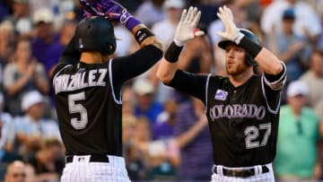 DENVER, CO - JUNE 8: Trevor Story #27 of the Colorado Rockies celebrates with Carlos Gonzalez #5 after a fifth inning two-run homerun against the Arizona Diamondbacks at Coors Field on June 8, 2018 in Denver, Colorado. (Photo by Dustin Bradford/Getty Images)
