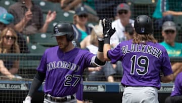 SEATTLE, WA - JULY 8: Charlie Blackmon #19 of the Colorado Rockies is congratulated by Trevor Story #27 of the Colorado Rockies after hitting a solo home run off o starting pitcher Wade LeBlanc #49 of the Seattle Mariners during the first inning of a game at Safeco Field on July 8, 2018 in Seattle, Washington. (Photo by Stephen Brashear/Getty Images)