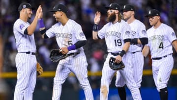 DENVER, CO - JULY 14: Nolan Arenado #28, Carlos Gonzalez #5, Charlie Blackmon #19, Trevor Story #27, and Pat Valaika #4 of the Colorado Rockies celebrate after a 4-1 win over the Seattle Mariners at Coors Field on July 14, 2018 in Denver, Colorado. (Photo by Dustin Bradford/Getty Images)