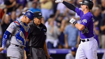DENVER, CO - AUGUST 10: Ryan McMahon #24 of the Colorado Rockies points to the stands and celebrates after hitting a seventh inning go-ahead two-run homerun against the Los Angeles Dodgers at Coors Field on August 10, 2018 in Denver, Colorado. (Photo by Dustin Bradford/Getty Images)