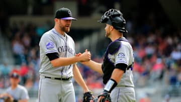 ATLANTA, GA - AUGUST 19: Wade Davis #71 of the Colorado Rockies celebrates beating the Atlanta Braves with Tony Wolters #14 at SunTrust Park on August 19, 2018 in Atlanta, Georgia. (Photo by Daniel Shirey/Getty Images)