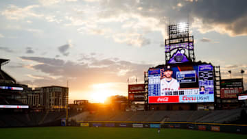 DENVER, CO - AUGUST 19: The sun sets over the stadium as Charlie Blackmon #19 of the Colorado Rockies jogs after a foul ball during the third inning against the Houston Astros at Coors Field on August 19, 2020 in Denver, Colorado. (Photo by Justin Edmonds/Getty Images)