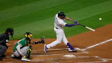 DENVER, CO - SEPTEMBER 15: Josh Fuentes #8 of the Colorado Rockies hits an RBI sacrifice fly during the sixth inning against the Oakland Athletics at Coors Field on September 15, 2020 in Denver, Colorado. (Photo by Justin Edmonds/Getty Images)
