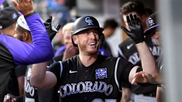 SEATTLE, WASHINGTON - JUNE 22: C.J. Cron #25 of the Colorado Rockies celebrates with teammates after hitting a home run in the seventh inning of the game against the Seattle Mariners at T-Mobile Park on June 22, 2021 in Seattle, Washington. The Seattle Mariners beat the Colorado Rockies 2-1. (Photo by Alika Jenner/Getty Images)