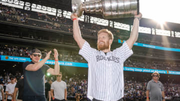 DENVER, COLORADO - JUNE 29: Gabriel Landeskog #92 of the Colorado Avalanche celebrates with the Stanley Cup prior to the game against the Colorado Rockies and Los Angeles Dodgers at Coors Field on June 29, 2022 in Denver, Colorado. (Photo by Harrison Barden/Colorado Rockies/Getty Images)