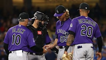 LOS ANGELES, CA - SEPTEMBER 17: Pitcher Jon Gray #55 of the Colorado Rockies gives up the ball to manager Bud Black #10 and leaves the game during the third inning of the MLB game against the Los Angeles Dodgers at Dodger Stadium on September 17, 2018 in Los Angeles, California. (Photo by Victor Decolongon/Getty Images)
