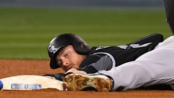 LOS ANGELES, CA - MAY 22: Trevor Story #27 of the Colorado Rockies beats the tag by Logan Forsythe #11 of the Los Angeles Dodgers for a stolen base in the sixth inning of the game at Dodger Stadium on May 22, 2018 in Los Angeles, California. (Photo by Jayne Kamin-Oncea/Getty Images)