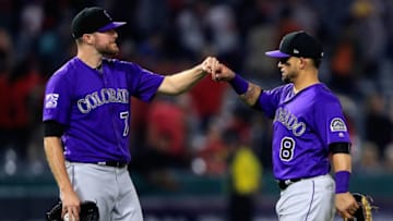 ANAHEIM, CA - AUGUST 28: Wade Davis #71 and Gerardo Parra #8 of the Colorado Rockies celebrate defeating the Los Angeles Angels of Anaheim 3-2 in a game at Angel Stadium on August 28, 2018 in Anaheim, California. (Photo by Sean M. Haffey/Getty Images)