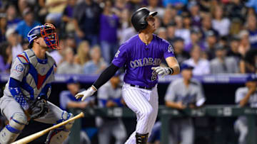 DENVER, CO - AUGUST 10: Ryan McMahon #24 of the Colorado Rockies follows the flight of a seventh inning go-ahead two-run homerun against the Los Angeles Dodgers at Coors Field on August 10, 2018 in Denver, Colorado. (Photo by Dustin Bradford/Getty Images)