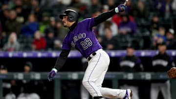DENVER, COLORADO - APRIL 22: Nolan Arenado #28 of the Colorado Rockies hits a solo home run and his 1,000th hit in the seventh inning against the Washington Nationals at Coors Field on April 22, 2019 in Denver, Colorado. (Photo by Matthew Stockman/Getty Images)