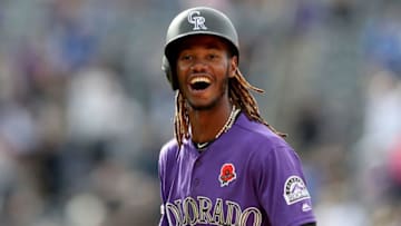 DENVER, COLORADO - MAY 27: Raimel Tapia #15 of the Colorado Rockies celebrates hitting a walk off single to drive in the wining run in the 11th inning against the Arizona Diamondbacks at Coors Field on May 27, 2019 in Denver, Colorado. (Photo by Matthew Stockman/Getty Images)