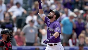 DENVER, COLORADO - MAY 30: David Dahl #26 of the Colorado Rockies celebrates as he crosses the plate after hitting a two-run home run run in the second inning against the Arizona Diamondbacks at Coors Field on May 30, 2019 in Denver, Colorado. (Photo by Matthew Stockman/Getty Images)
