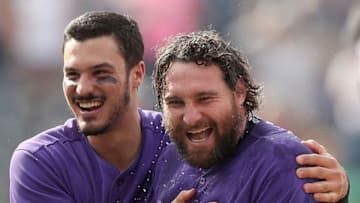 DENVER, COLORADO - MAY 30: Nolan Arenado #28 congratulates Daniel Murphy #9 of the Colorado Rockies after his RBI walk off single in the tenth inning against the Arizona Diamondbacks at Coors Field on May 30, 2019 in Denver, Colorado. (Photo by Matthew Stockman/Getty Images)