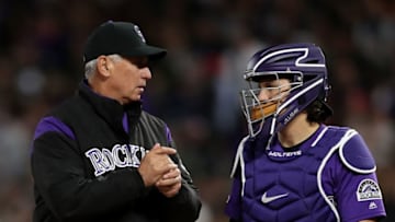 DENVER, COLORADO - APRIL 18: Manager Bud Black and catcher Tony Wolters #14 of the Colorado Rockies confer on the mound while changing pitchers in the seventh inning against the Philadelphia Phillies at Coors Field on April 18, 2019 in Denver, Colorado. (Photo by Matthew Stockman/Getty Images)