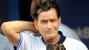 TORONTO, CANADA - AUGUST 14: Actor Charlie Sheen throws out the ceremonial first pitch prior to MLB game action between the Toronto Blue Jays and Chicago White Sox August 14, 2012 at Rogers Centre in Toronto, Ontario, Canada. (Photo by Brad White/Getty Images)