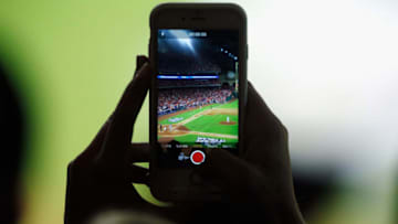 HOUSTON, TX - OCTOBER 27: A fan uses an iphone during game three of the 2017 World Series between the Houston Astros and the Los Angeles Dodgers at Minute Maid Park on October 27, 2017 in Houston, Texas. (Photo by Bob Levey/Getty Images)