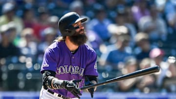 DENVER, CO - AUGUST 18: Charlie Blackmon #19 of the Colorado Rockies follows the flight of a sixth inning solo home run against the Miami Marlins at Coors Field on August 18, 2019 in Denver, Colorado. (Photo by Dustin Bradford/Getty Images)