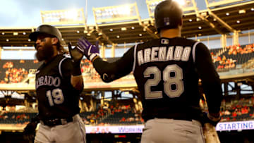 WASHINGTON, DC - JULY 25: Charlie Blackmon #19 of the Colorado Rockies celebrates with Nolan Arenado #28 after scoring the go ahead run in the ninth inning against the Washington Nationals at Nationals Park on July 25, 2019 in Washington, DC. (Photo by Rob Carr/Getty Images)