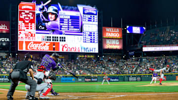 DENVER, CO - JULY 13: Nolan Arenado #28 of the Colorado Rockies hits a first inning 2-run home run against the Cincinnati Reds during a game at Coors Field on July 13, 2019 in Denver, Colorado. (Photo by Dustin Bradford/Getty Images)