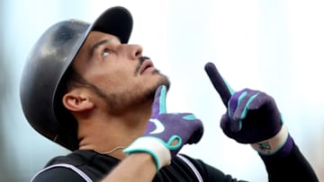 DENVER, COLORADO - MAY 24: Nolan Arenado #28 pof the Colorado Rockies celebrates as he crosses home plate after hitting a solo home run in the first inning against the Baltimore Orioles at Coors Field on May 24, 2019 in Denver, Colorado. (Photo by Matthew Stockman/Getty Images)
