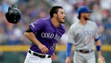 DENVER, COLORADO - JUNE 11: Nolan Arenado #28 of the Colorado Rockies rounds third base to score on a Daniel Murphy 2 RBI double in the first inning against the Chicago Cubs at Coors Field on June 11, 2019 in Denver, Colorado. (Photo by Matthew Stockman/Getty Images)