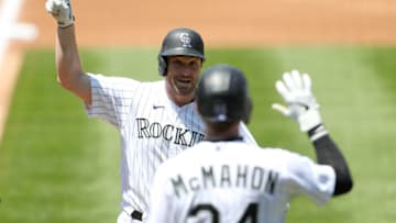 DENVER, COLORADO - AUGUST 02: Daniel Murphy #9 of the Colorado Rockies celebrates with Ryan McMahon #24 after hitting a solo home run in the second inning against the San Diego Padres at Coors Field on August 02, 2020 in Denver, Colorado. (Photo by Matthew Stockman/Getty Images)