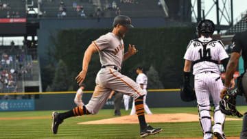 Sep 6, 2017; Denver, CO, USA; San Francisco Giants right fielder Hunter Pence (8) scores a run in the first inning against the Colorado Rockies at Coors Field. Mandatory Credit: Ron Chenoy-USA TODAY Sports