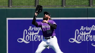Mar 3, 2020; Salt River Pima-Maricopa, Arizona, USA; Colorado Rockies right fielder Charlie Blackmon (19) makes a running catch for an out against the Chicago Cubs during a spring training game at Salt River Fields at Talking Stick. Mandatory Credit: Rick Scuteri-USA TODAY Sports