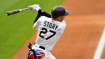 Aug 15, 2020; Denver, Colorado, USA; Colorado Rockies shortstop Trevor Story (27) triples in the first inning against the Texas Rangers at Coors Field. Mandatory Credit: Ron Chenoy-USA TODAY Sports