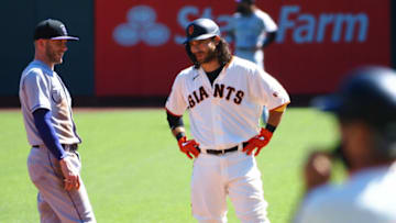 Sep 24, 2020; San Francisco, California, USA; San Francisco Giants shortstop Brandon Crawford (35) speaks with Colorado Rockies shortstop Trevor Story (27) after hitting an RBI double during the first inning at Oracle Park. Mandatory Credit: Kelley L Cox-USA TODAY Sports